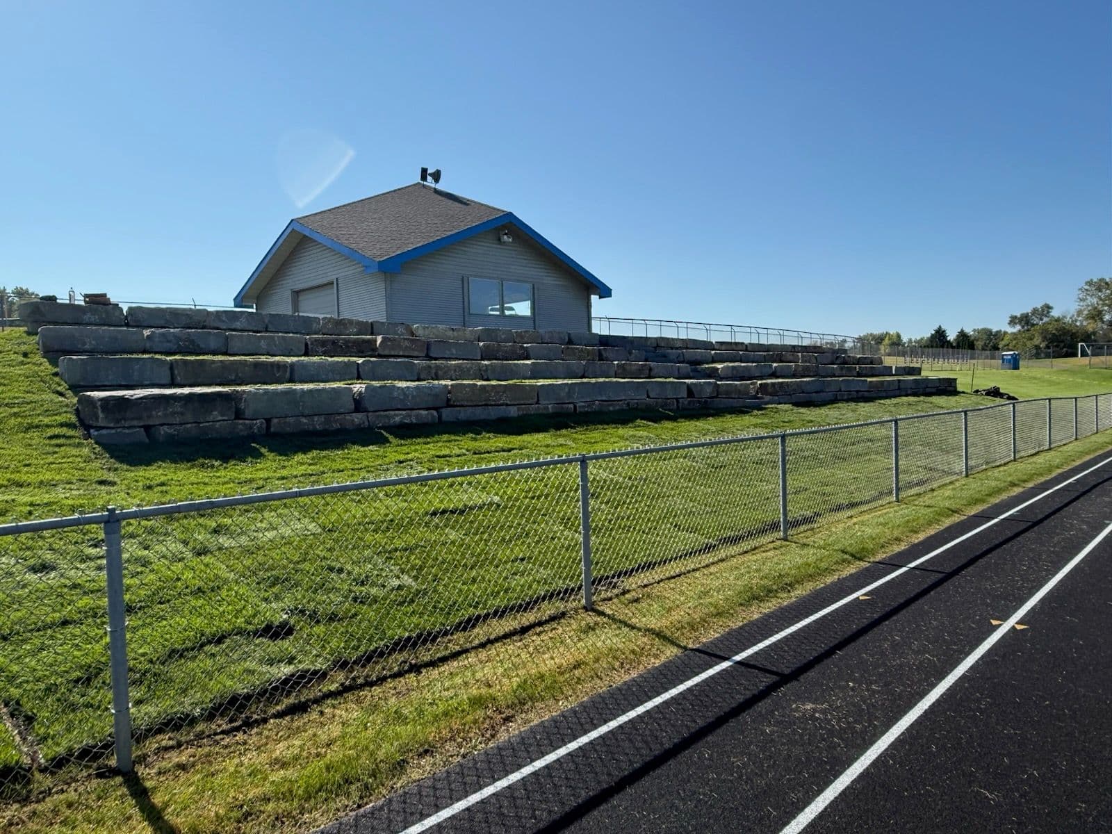 KC Limestone Amphitheater Seating and Retaining Wall Completed image